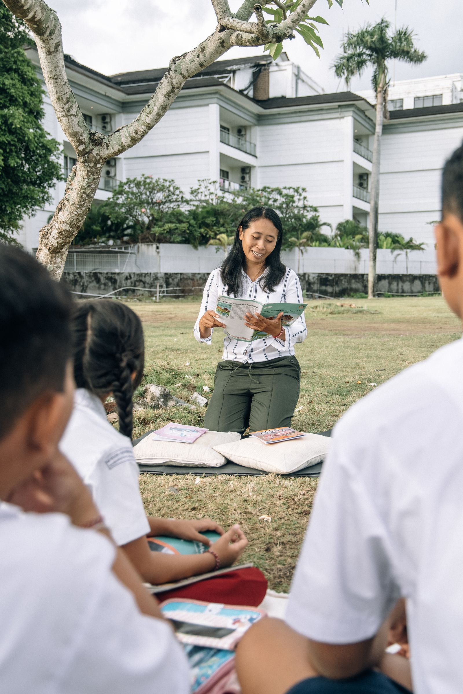 Children studying together outdoors